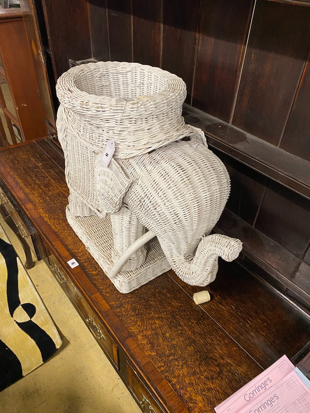 A painted wicker elephant jardiniere, height 50cm